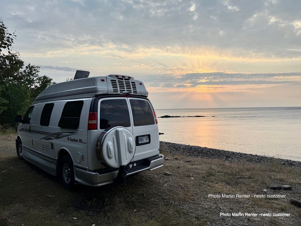 Camper with sunset with nesto