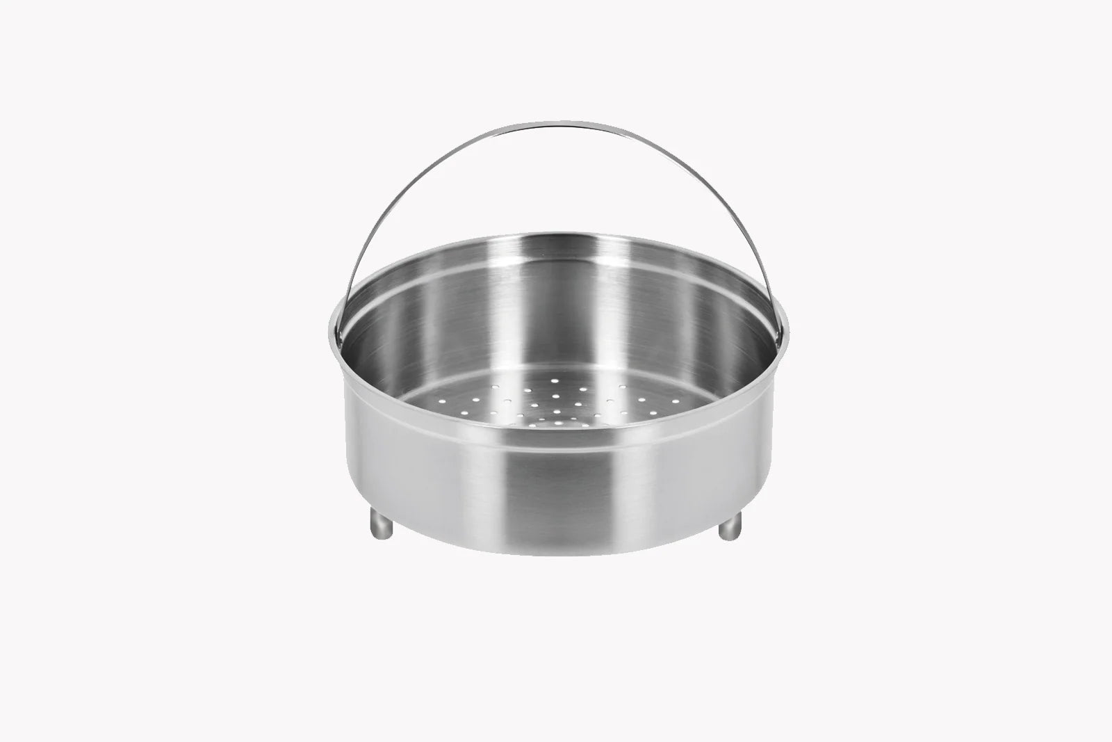 Stainless steel steamer basket on a white background
