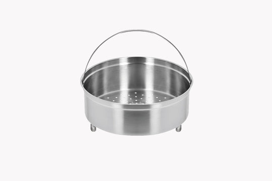 Stainless steel steamer basket on a white background